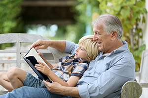 Grandfather Reading to Grandchild